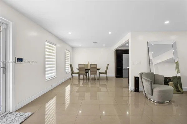 a spacious bedroom with a bed and a couch