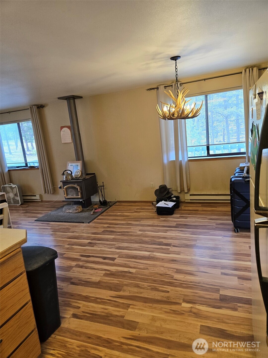 117 Squirrel Road Tonasket, WA 98855 - Photo 24 of 24 a room with wooden floor and window