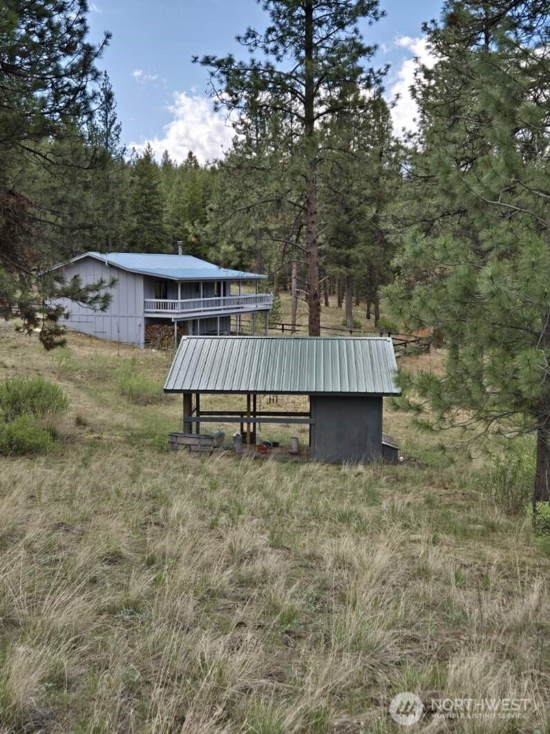 117 Squirrel Road Tonasket, WA 98855 - Photo 4 of 24 front view of a house with a yard