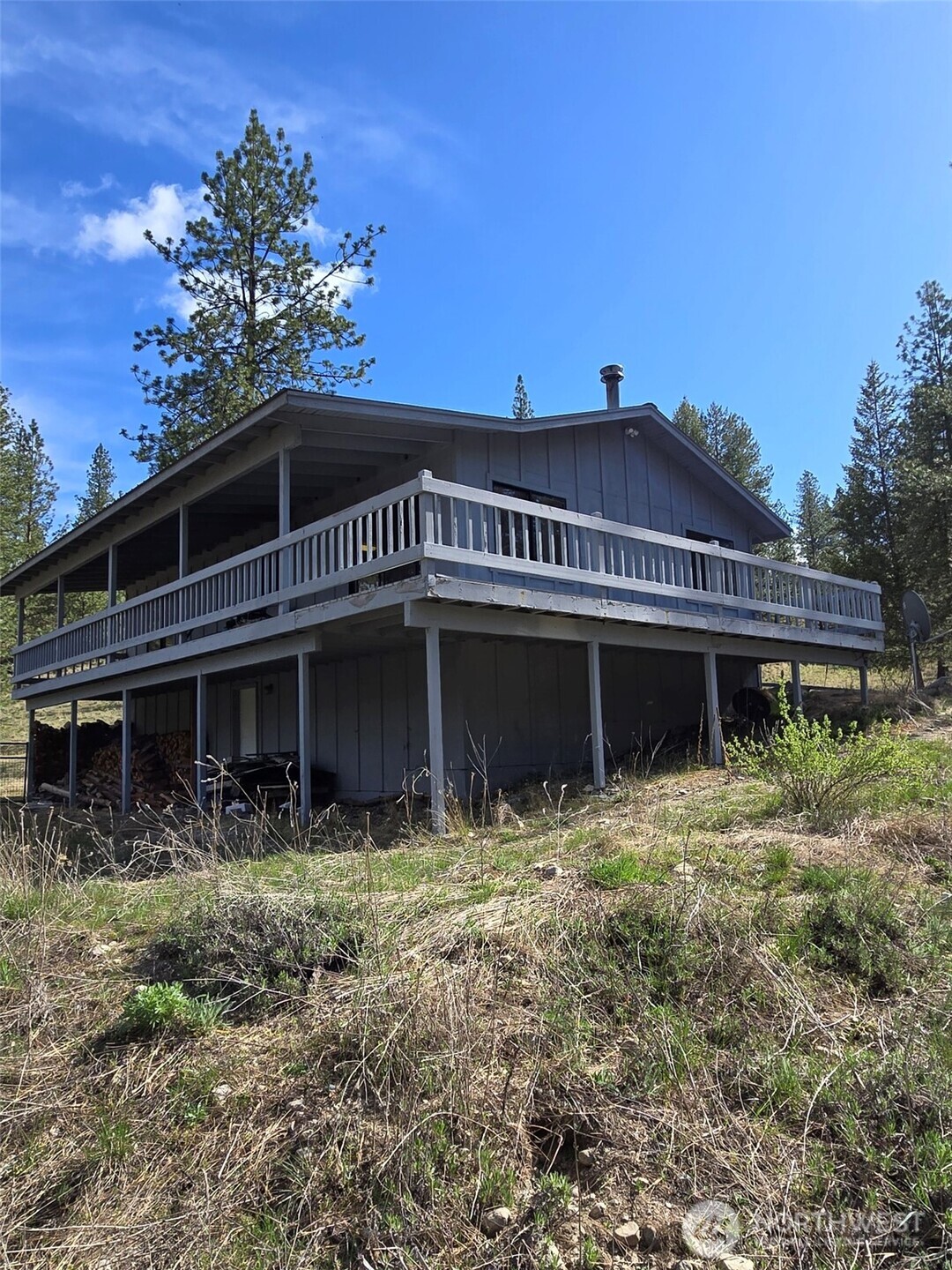 117 Squirrel Road Tonasket, WA 98855 - Photo 5 of 24 a front view of a house with a yard