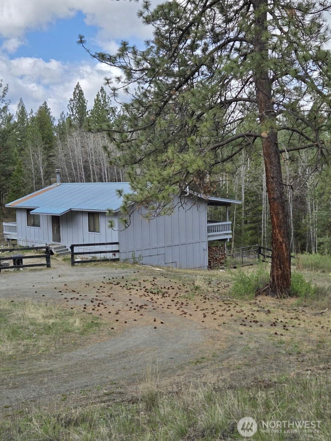 117 Squirrel Road Tonasket, WA 98855 - Photo 6 of 24 a view of a house with a yard