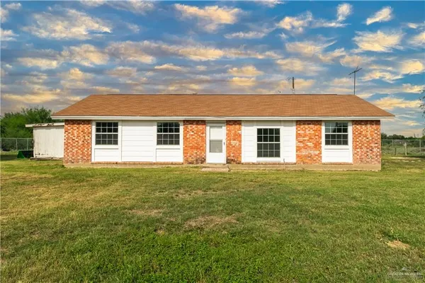 a view of a yard in front of a house