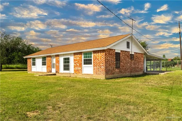 a view of a house with a big yard