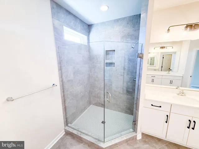 a bathroom with a sink and vanity