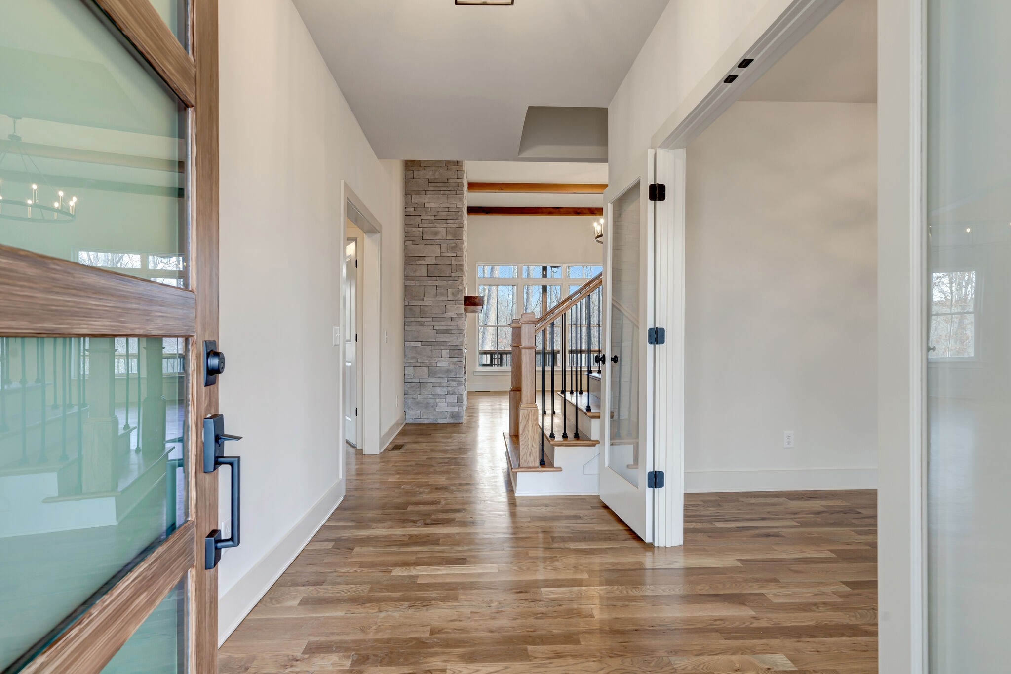 1325 Campbell Ridge Road Kingston Springs, TN 37082 - Photo 5 of 42 a view of a hallway with wooden floor and staircase