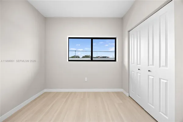 a view of an empty room with a window