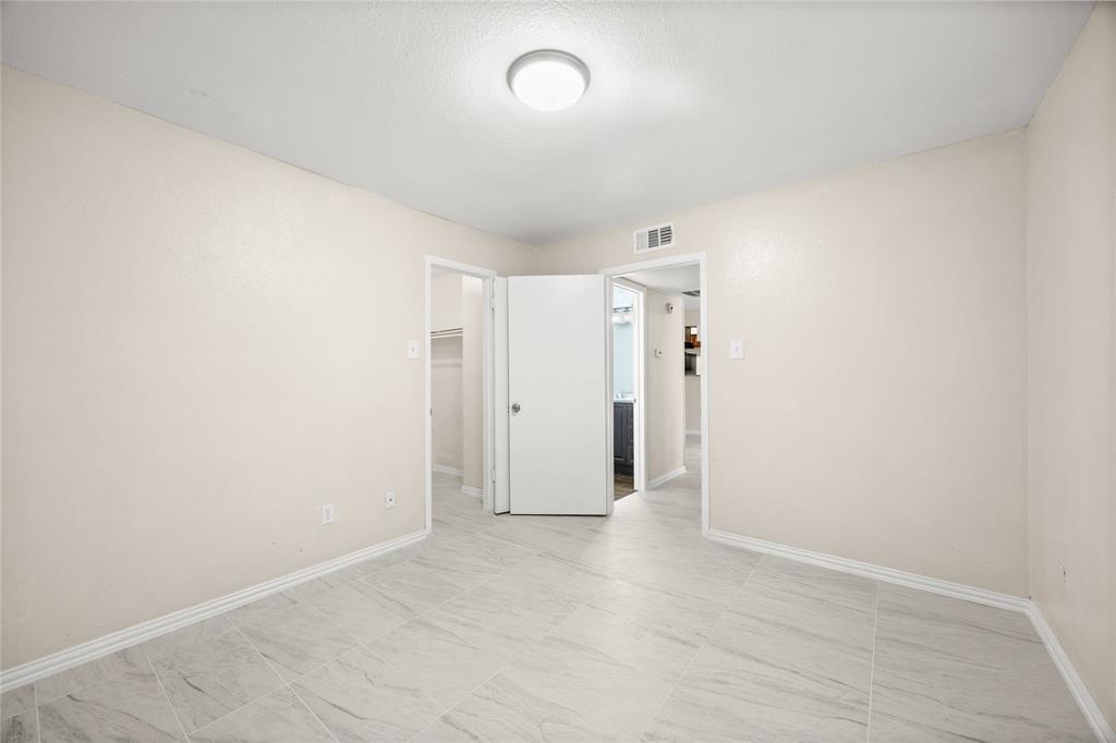 8110 Skillman Street, Unit 2053 Dallas, TX 75231 - Photo 9 of 12 wooden floor in an empty room