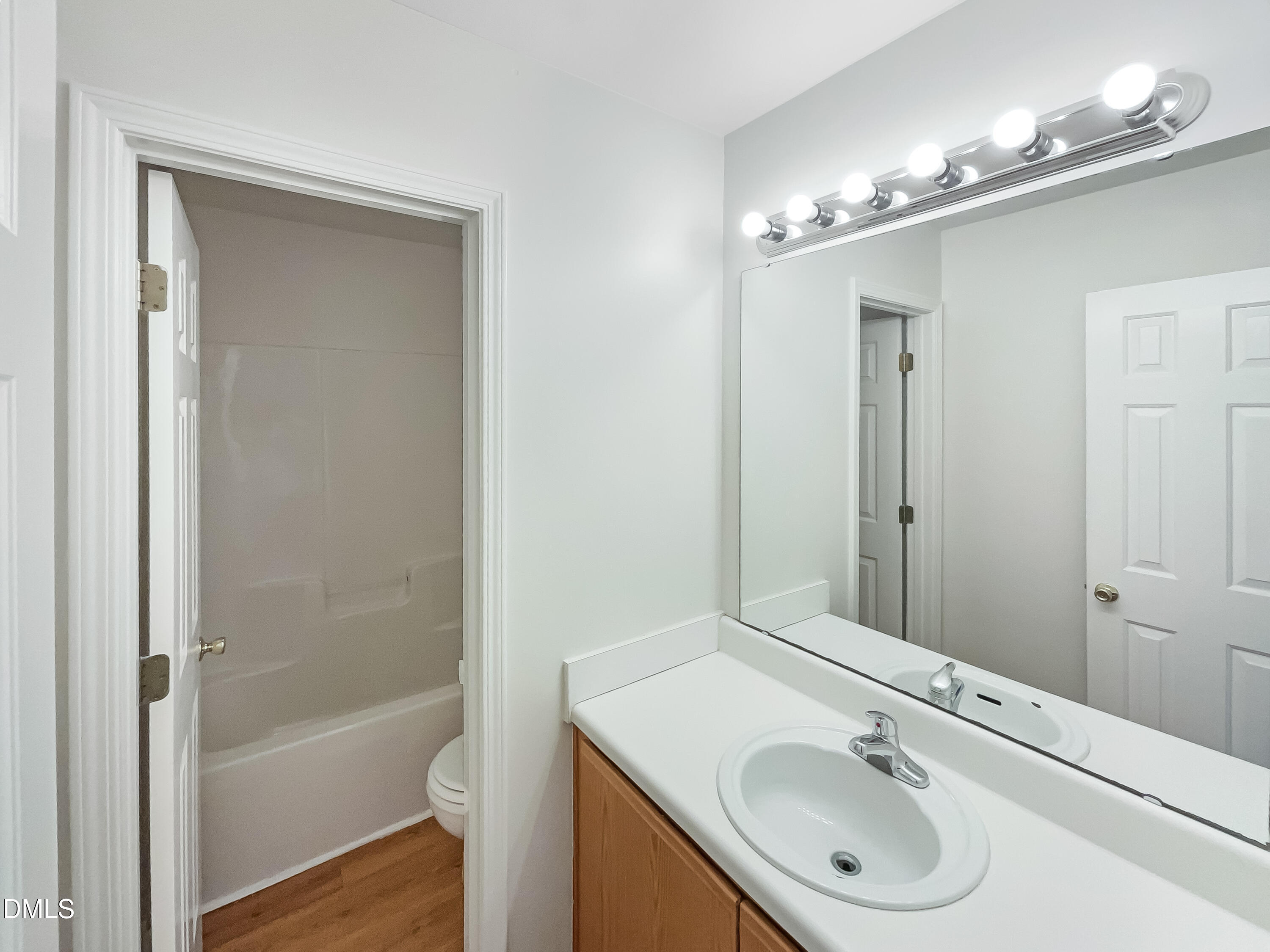 2504 Landale Court Raleigh, NC 27610 - Photo 13 of 16 a bathroom with a sink double vanity and a mirror