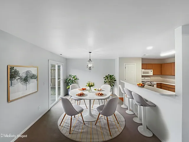 a dining room with furniture and window