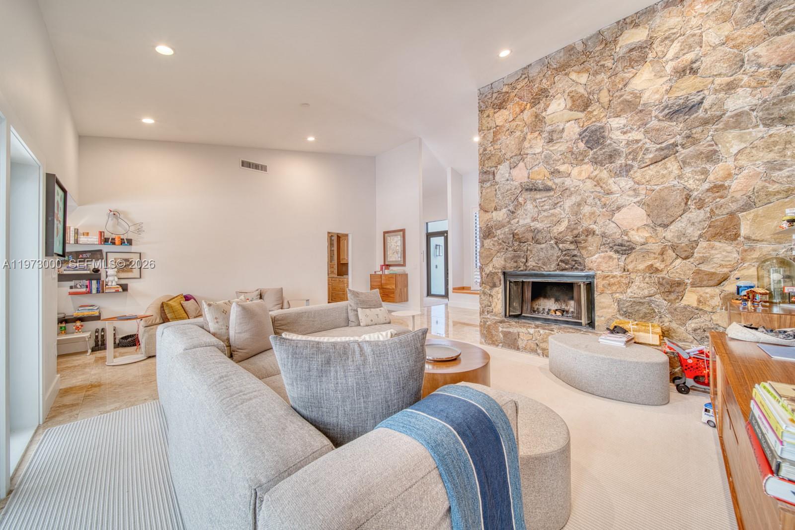 9220 Southwest 102nd Street Miami, FL 33176 - Photo 18 of 53 a living room with furniture and a fireplace