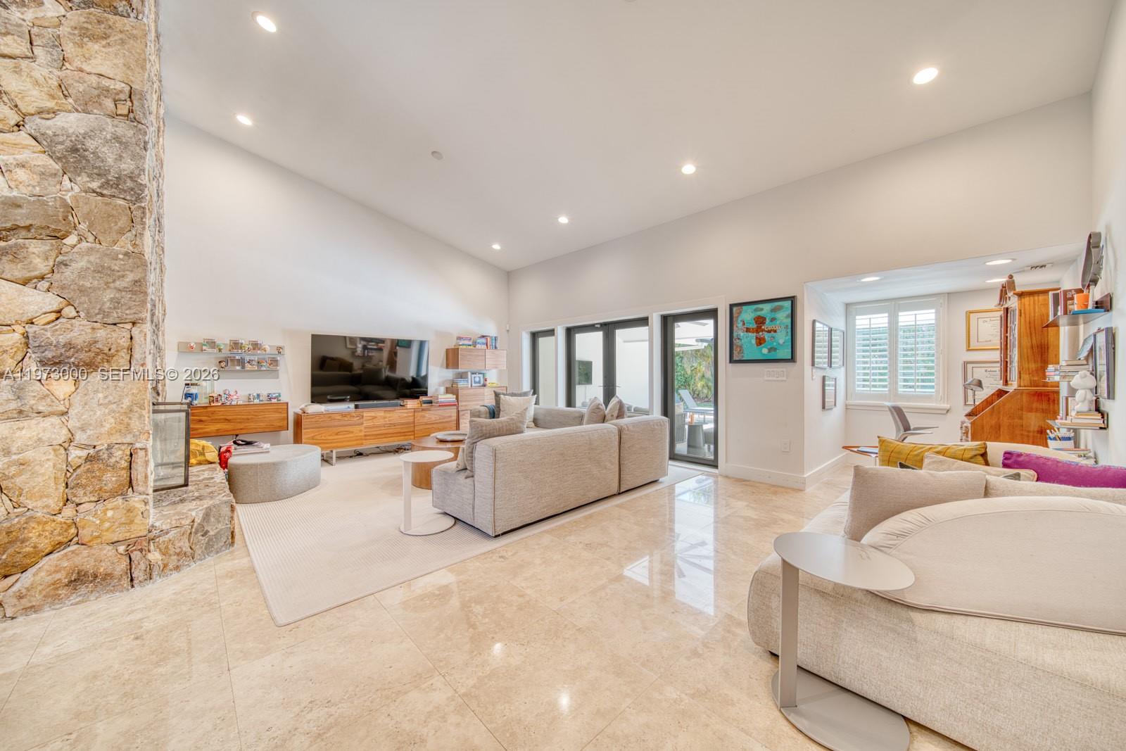 9220 Southwest 102nd Street Miami, FL 33176 - Photo 19 of 53 a living room with furniture and a flat screen tv