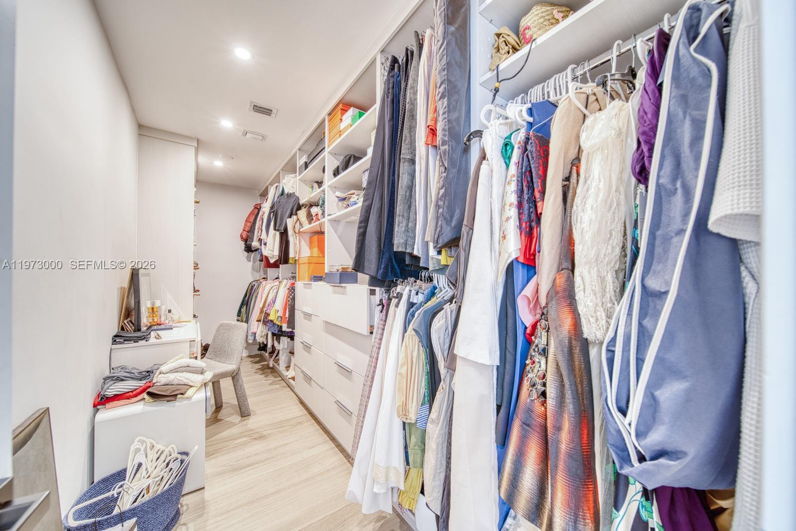 9220 Southwest 102nd Street Miami, FL 33176 - Photo 26 of 53 a view of walk in closet with clothes and shoes