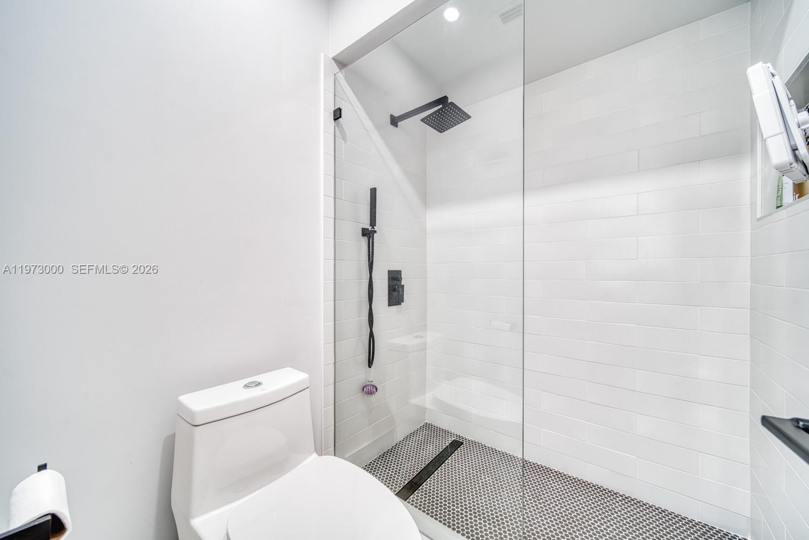 9220 Southwest 102nd Street Miami, FL 33176 - Photo 33 of 53 a bathroom with a toilet and a shower