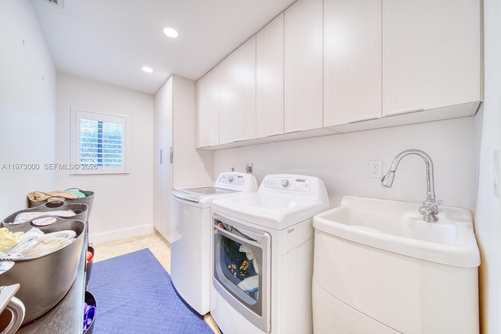 9220 Southwest 102nd Street Miami, FL 33176 - Photo 41 of 53 a utility room with dryer and washer