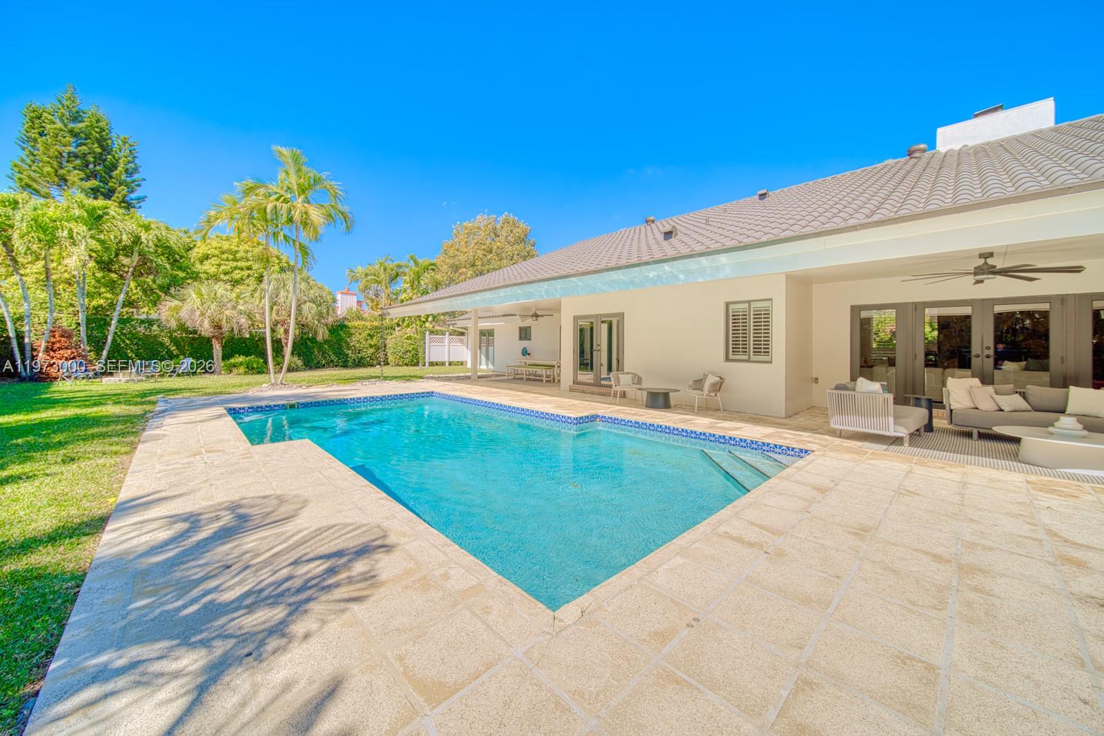 9220 Southwest 102nd Street Miami, FL 33176 - Photo 52 of 53 a view of a house with swimming pool and sitting area