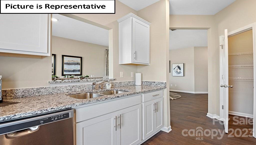 7035 North Mill Road Charlotte, NC 28216 - Photo 12 of 26 a kitchen with stainless steel appliances granite countertop a sink and a stove