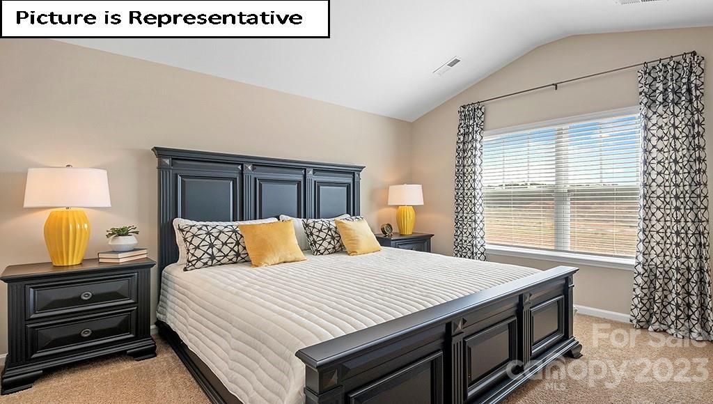 7035 North Mill Road Charlotte, NC 28216 - Photo 16 of 26 a bedroom with a bed and a dresser