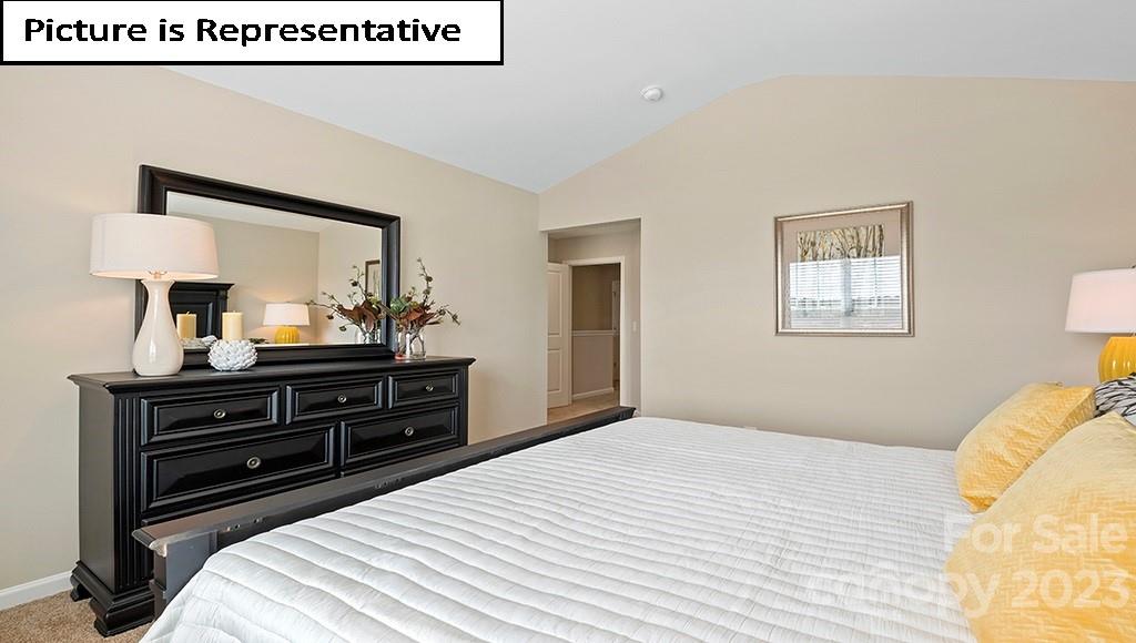 7035 North Mill Road Charlotte, NC 28216 - Photo 17 of 26 a bedroom with a bed and a dresser