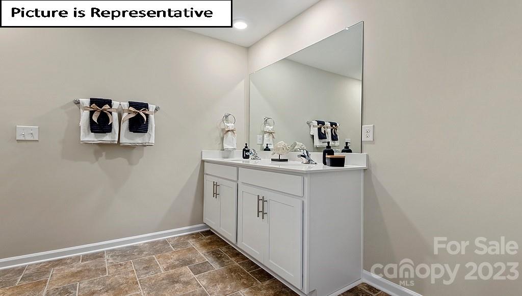 7035 North Mill Road Charlotte, NC 28216 - Photo 18 of 26 a bathroom with a sink and a mirror