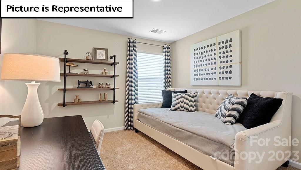 7035 North Mill Road Charlotte, NC 28216 - Photo 23 of 26 a living room with furniture and a couch