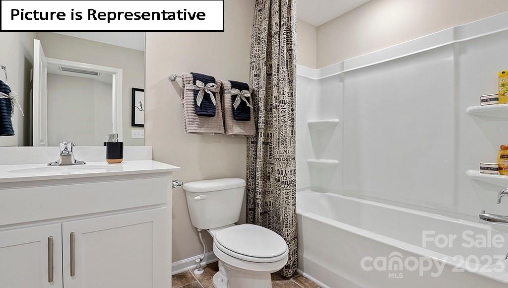 7035 North Mill Road Charlotte, NC 28216 - Photo 25 of 26 a bathroom with a toilet a sink and a bathtub