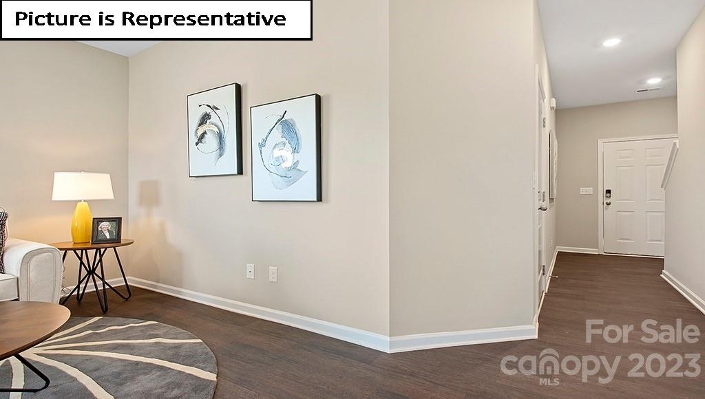 7035 North Mill Road Charlotte, NC 28216 - Photo 3 of 26 a view of a hallway with wooden floor