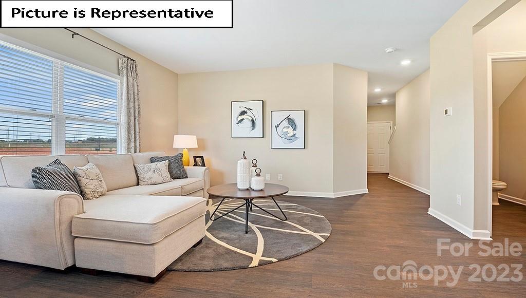7035 North Mill Road Charlotte, NC 28216 - Photo 6 of 26 a living room with furniture and a window