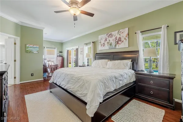 a bed room with a bed and a large window