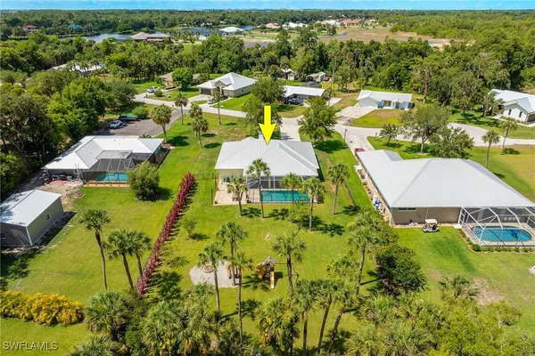 an aerial view of residential houses with outdoor space