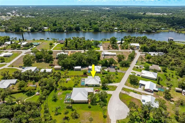an aerial view of residential houses with outdoor space