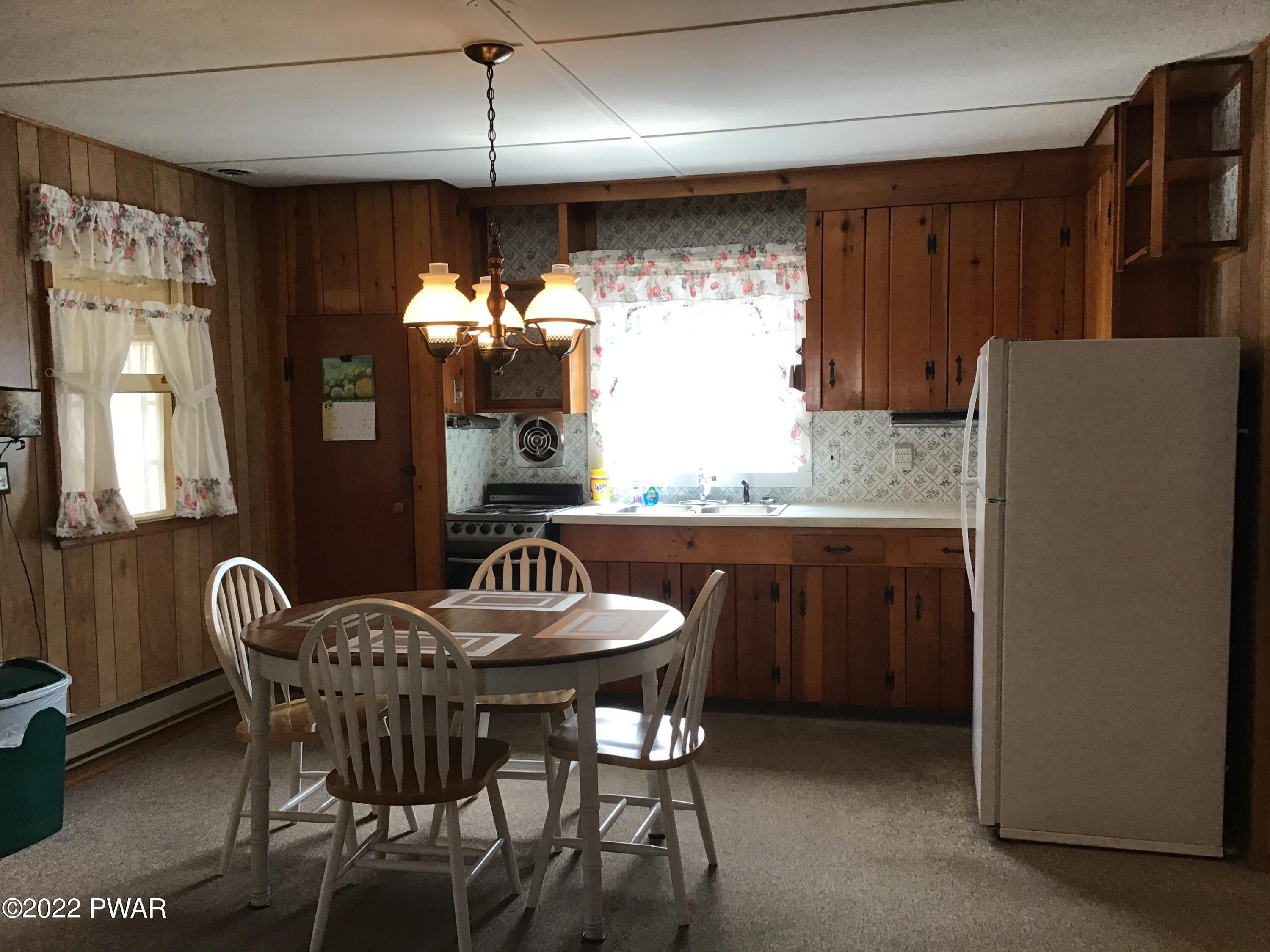 103 Ness Road Dingmans Ferry, PA 18328 - Photo 9 of 20 bright and sunnt kitchen