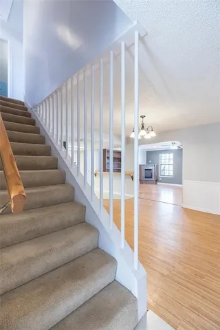a view of an entryway with wooden floor