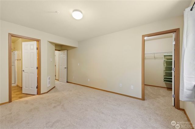 an empty room with closet area