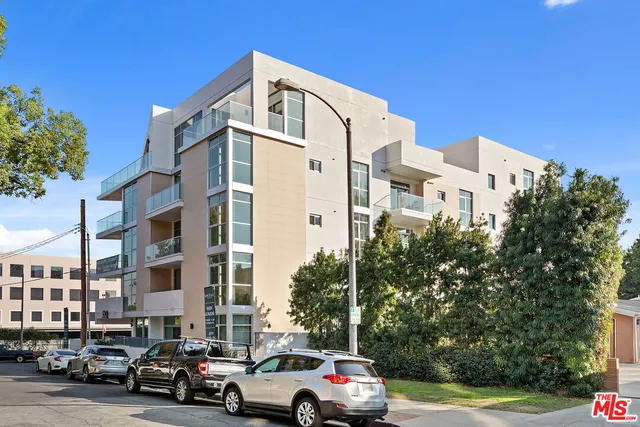 view of a living room with a baby crib
