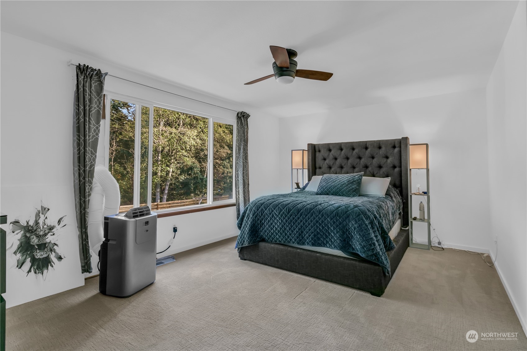 1130 Southwest 354th Street Federal Way, WA 98023 - Photo 21 of 25 a bedroom with a large bed and a chandelier