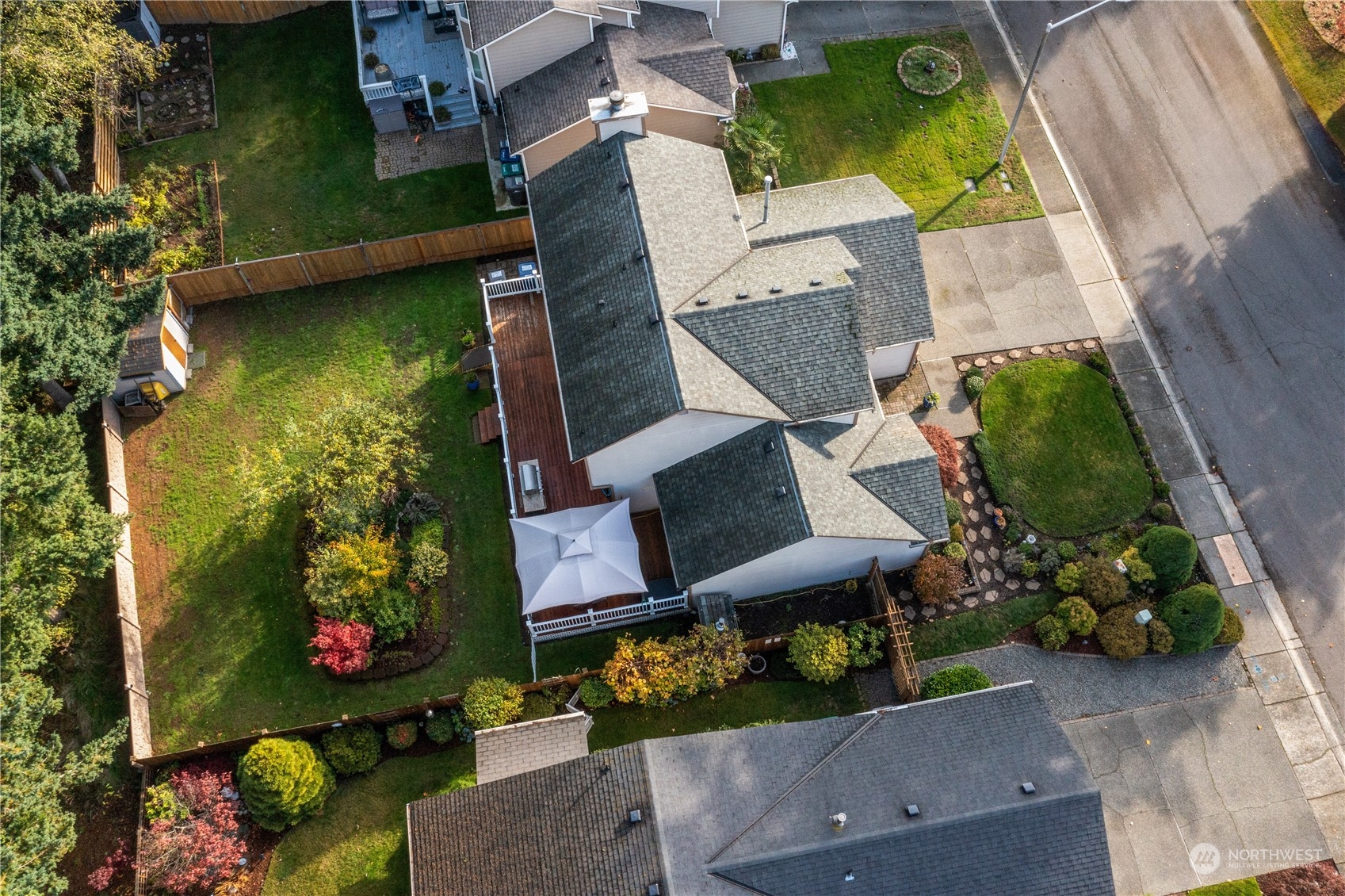 1130 Southwest 354th Street Federal Way, WA 98023 - Photo 5 of 25 an aerial view of a house with a yard and a large tree