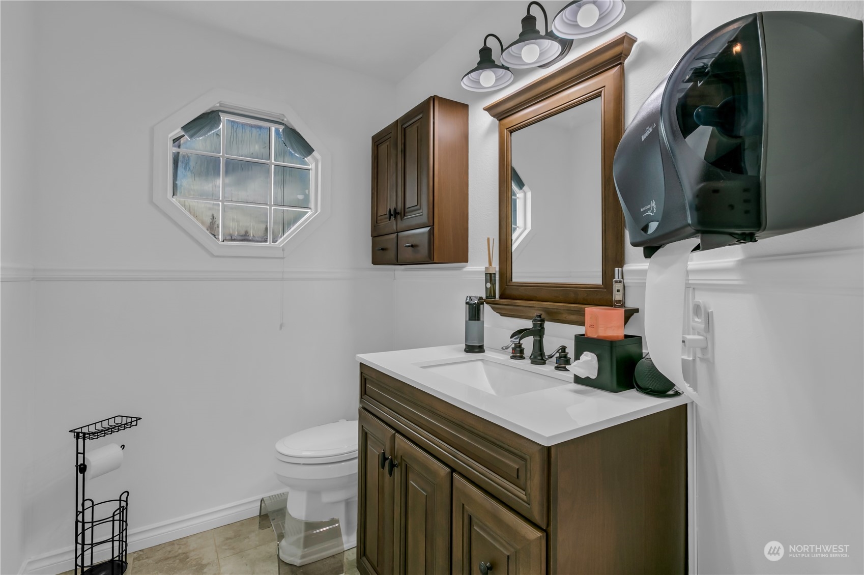 1130 Southwest 354th Street Federal Way, WA 98023 - Photo 9 of 25 a bathroom with a sink a toilet and a mirror