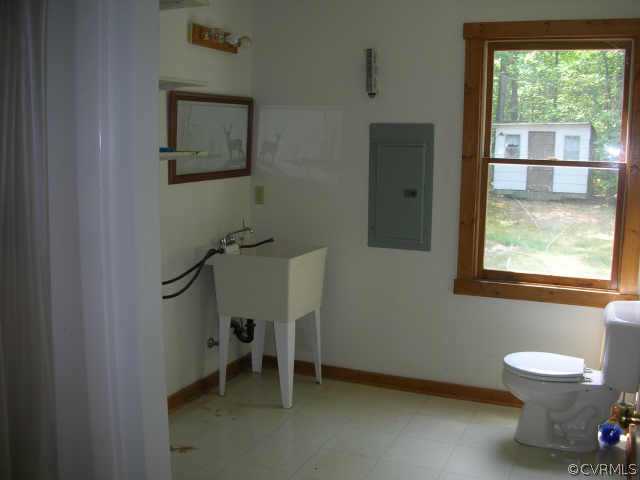 3390 Forest Grove Road Sandy Hook, VA 23153 - Photo 5 of 10 a bathroom with a toilet