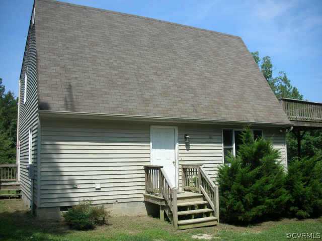3390 Forest Grove Road Sandy Hook, VA 23153 - Photo 8 of 10 a front view of a house with a yard