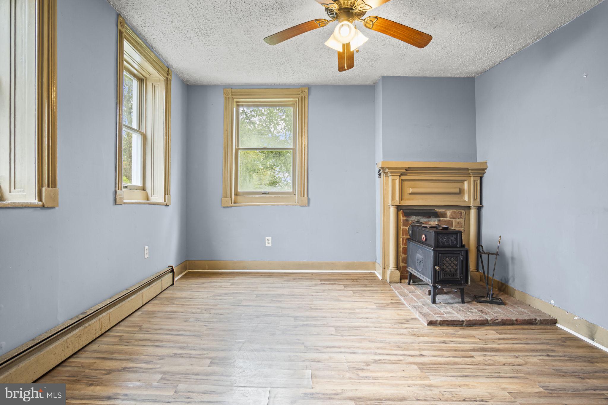 2065 Goldenville Road Gettysburg, PA 17325 - Photo 11 of 51 an empty room with windows and ceiling fan