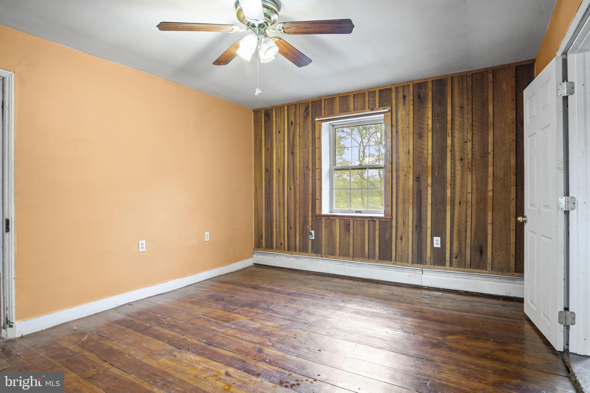 2065 Goldenville Road Gettysburg, PA 17325 - Photo 15 of 51 wooden floor in an empty room with a window