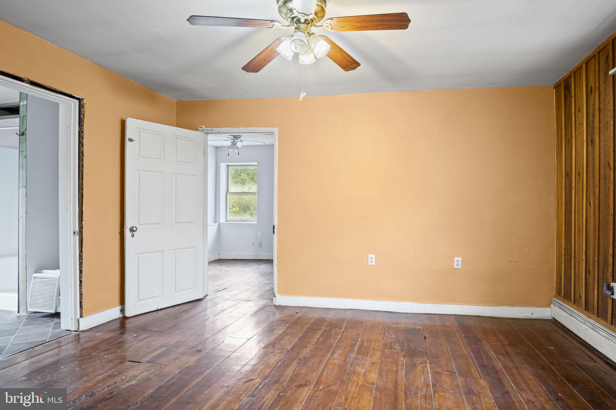 2065 Goldenville Road Gettysburg, PA 17325 - Photo 16 of 51 a view of empty room with wooden floor and fan