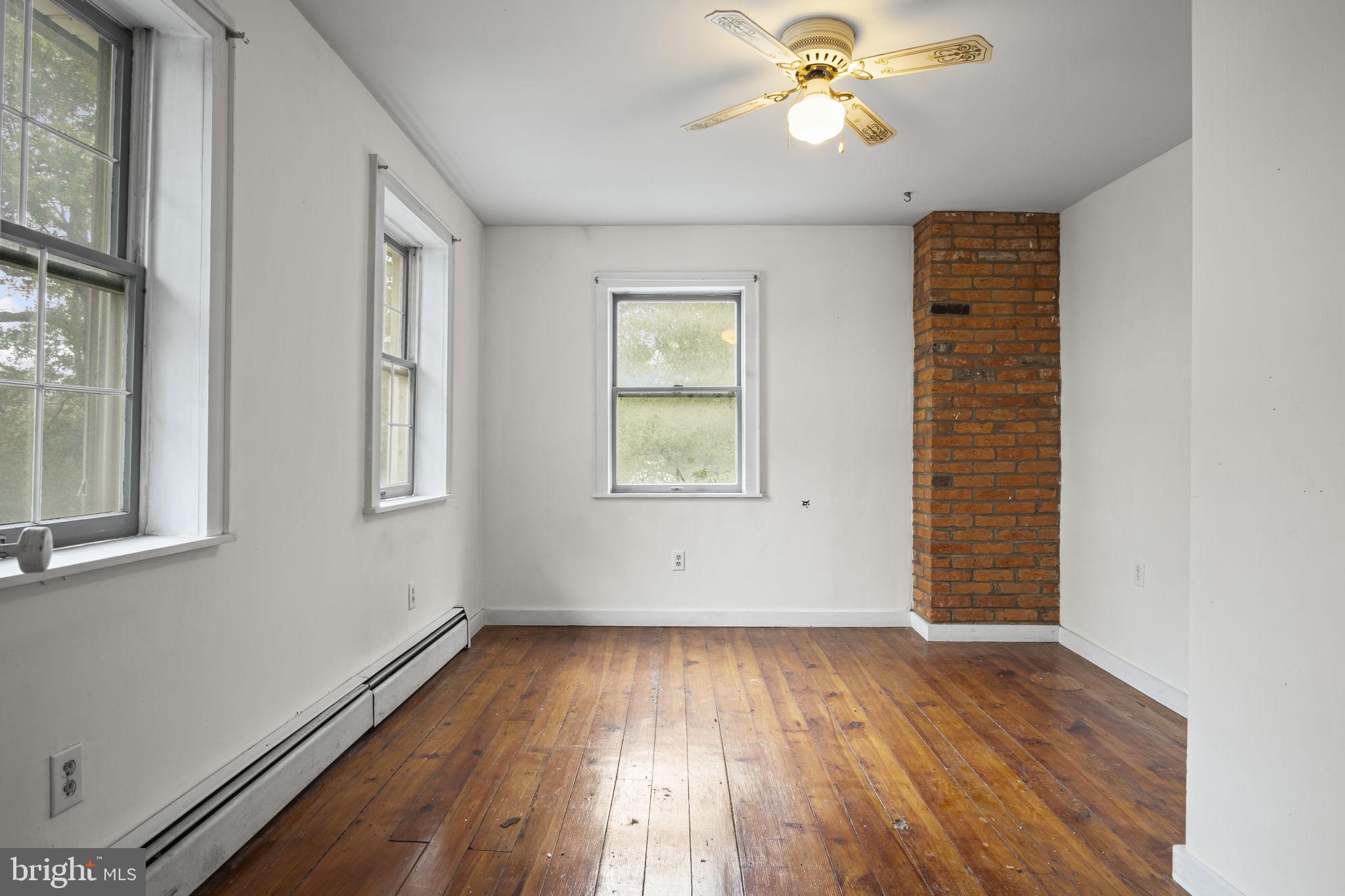 2065 Goldenville Road Gettysburg, PA 17325 - Photo 19 of 51 wooden floor in an empty room with a window
