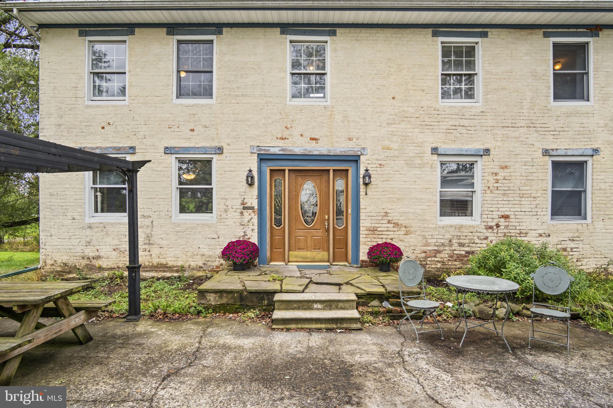 2065 Goldenville Road Gettysburg, PA 17325 - Photo 2 of 51 a front view of a house with outdoor seating area