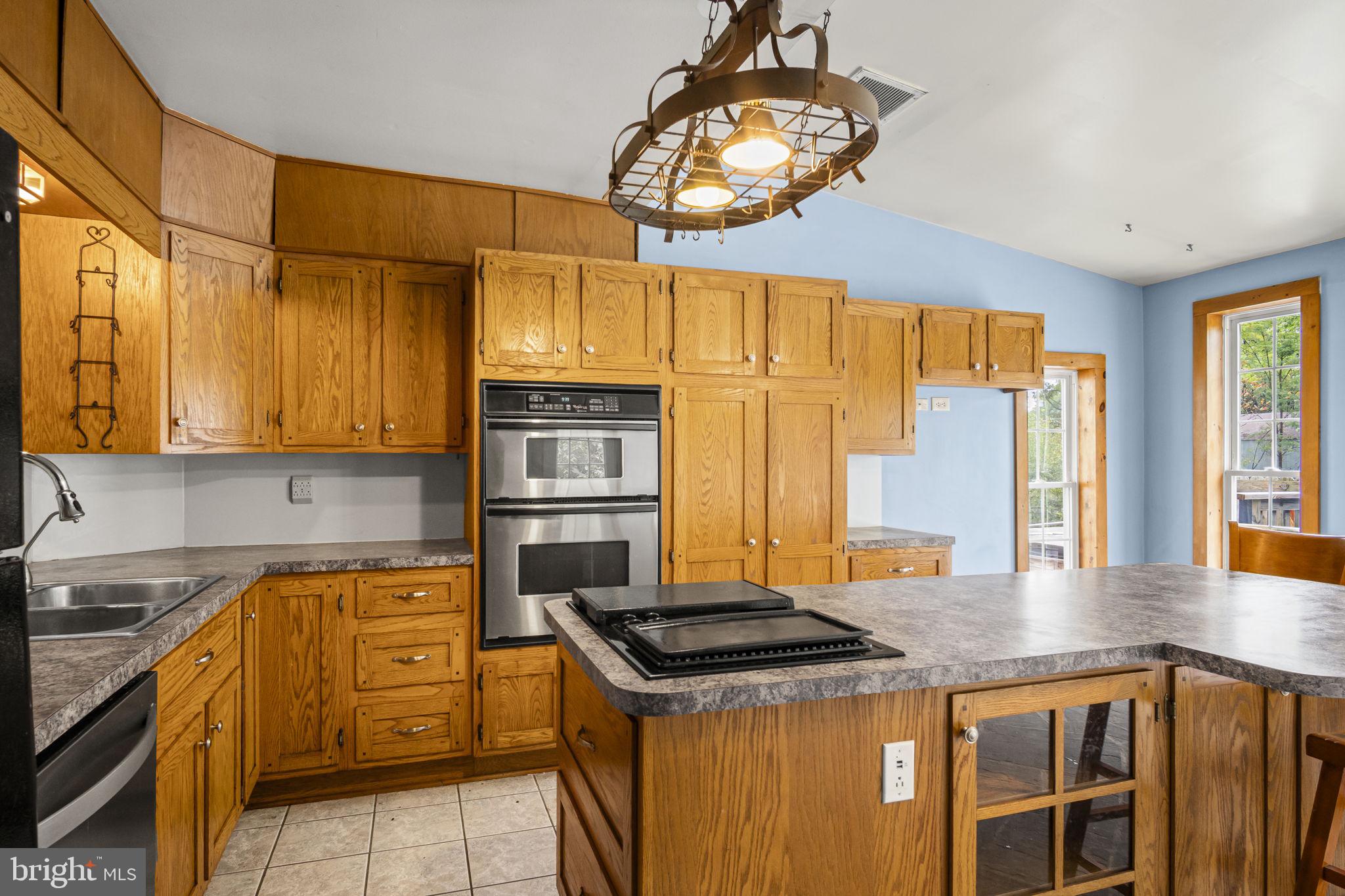 2065 Goldenville Road Gettysburg, PA 17325 - Photo 3 of 51 a kitchen with stainless steel appliances granite countertop a stove and a sink