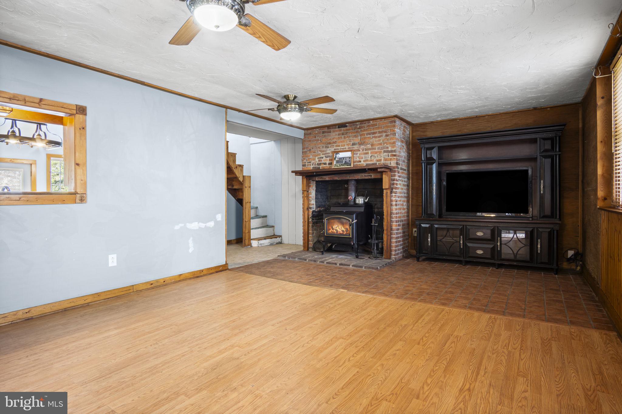 2065 Goldenville Road Gettysburg, PA 17325 - Photo 9 of 51 a view of empty room with a fireplace and window