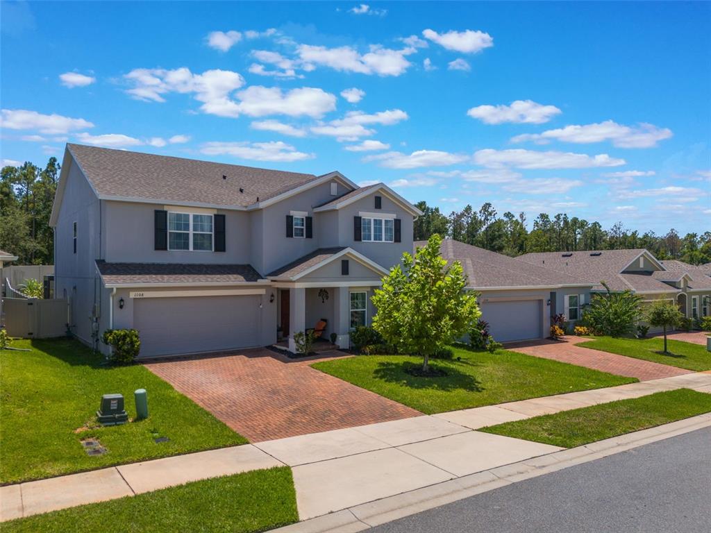 a front view of a house with yard