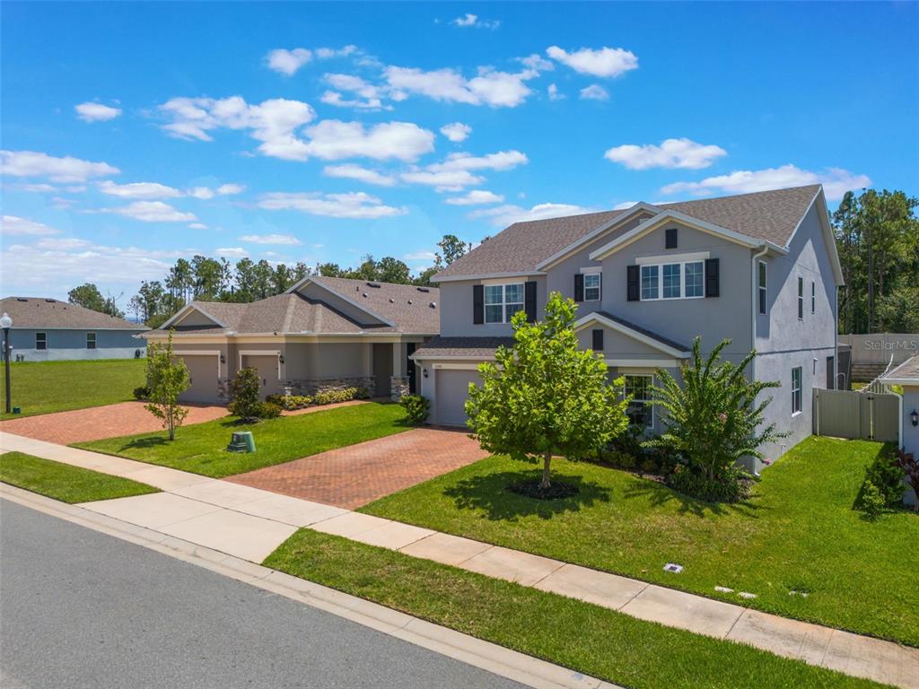 1108 Cavender Creek Road Minneola, FL 34715 - Photo 2 of 54 a front view of house with yard and green space