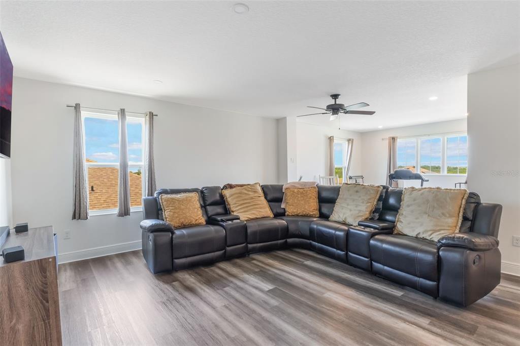 1108 Cavender Creek Road Minneola, FL 34715 - Photo 26 of 54 a living room with furniture and a window