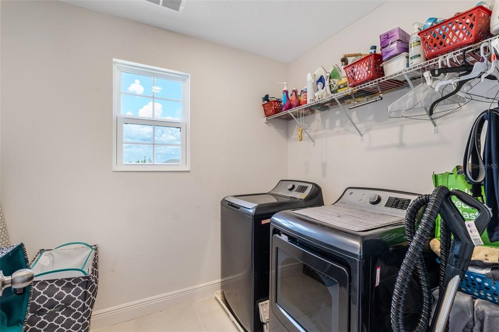 1108 Cavender Creek Road Minneola, FL 34715 - Photo 39 of 54 a utility room with dryer and washer